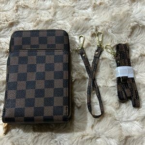 Brown, 3 pouch purslette. Wristlet strap and crossbody strap.